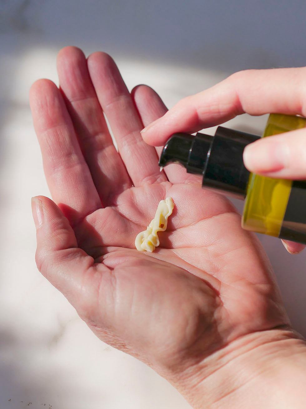 body cream being put into hand